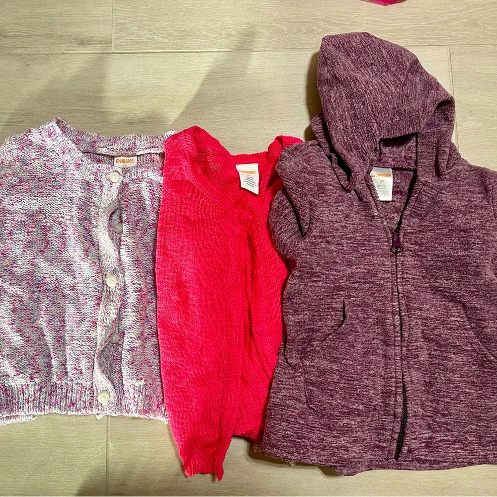 Buttoned up sweater and zippered sweatshirt